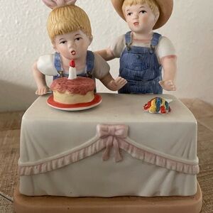 Charming Ceramic Figurine with Cake